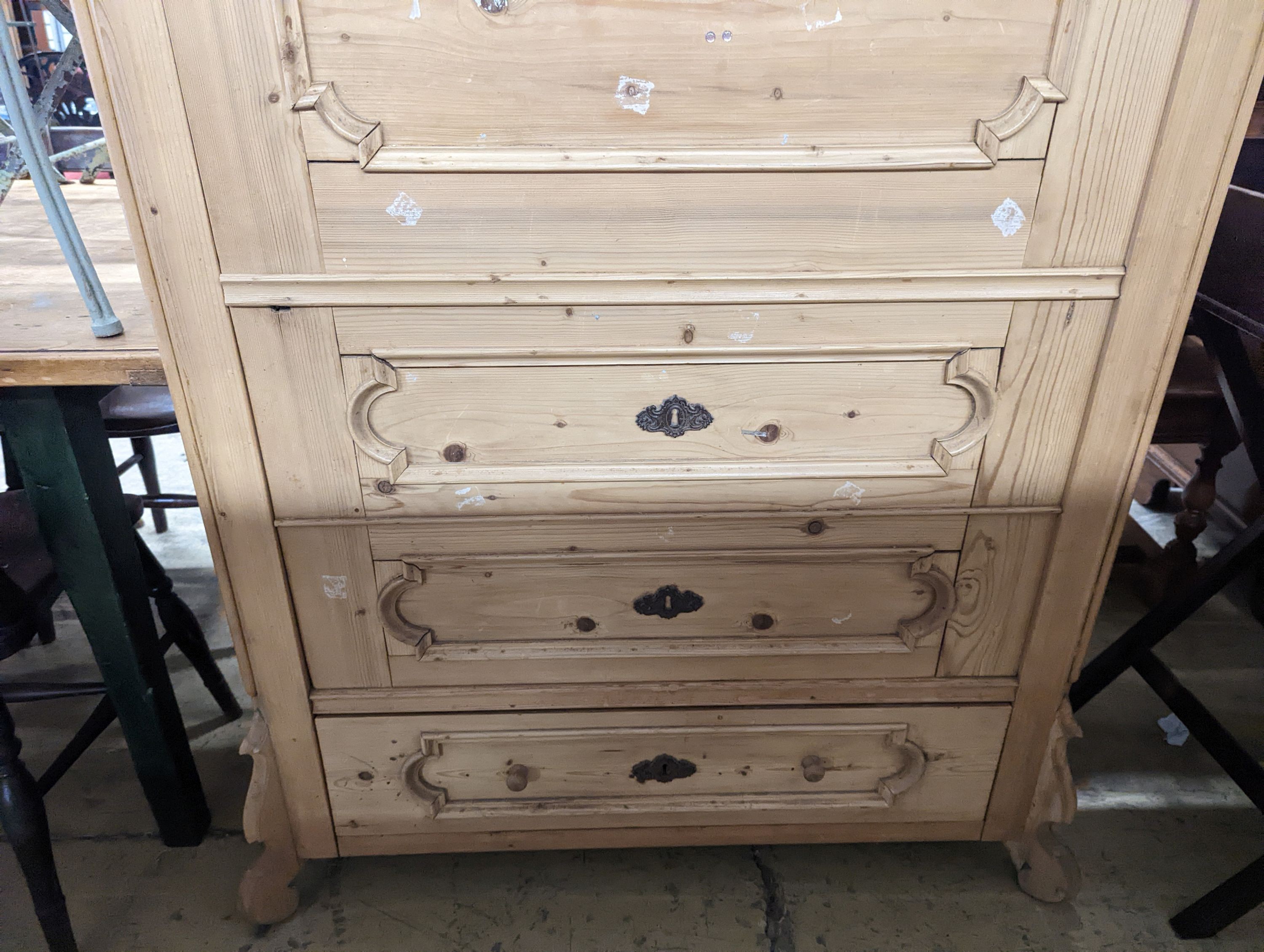 A 19th century Continental pale pine hanging cupboard with dummy drawer front, width 104cm, depth 50cm, height 183cm